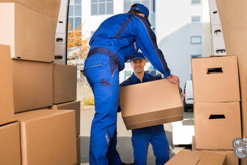 men moving boxes off a moving truck 2 1024x684 1